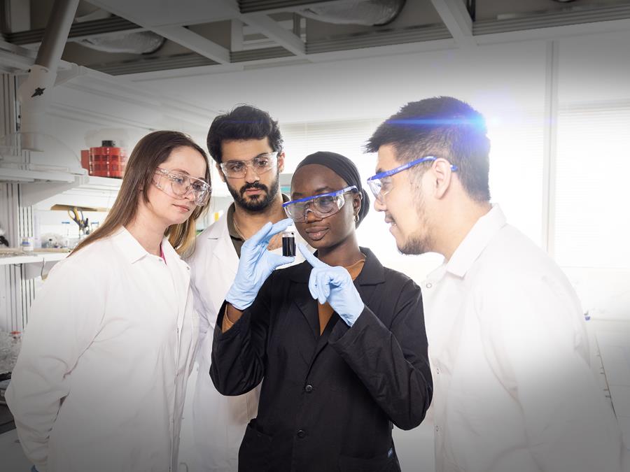 Scientists studying Mxenes in a lab