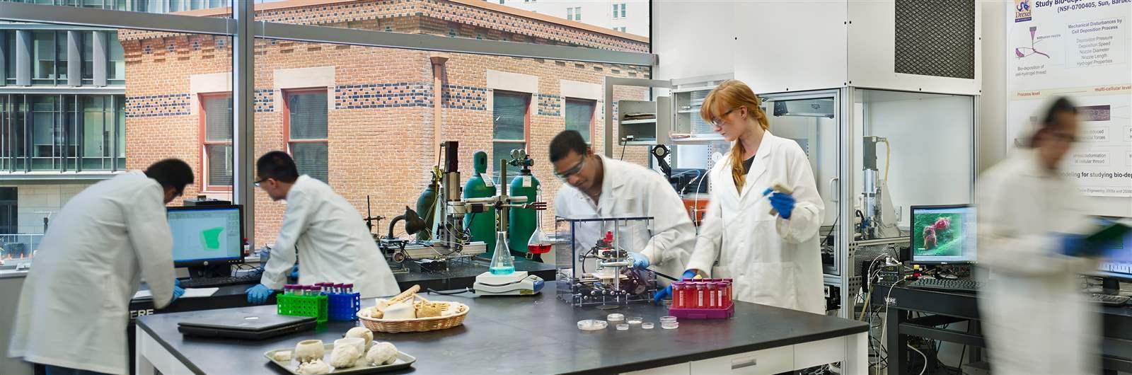 Group of students conducting research in a lab