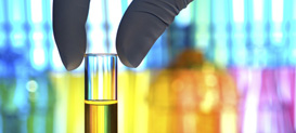 Hand and isolated test tube in a research laboratory.