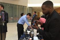 Obinna Otti demonstrates some pieces from the Tech Lending Library at the March 24 Collaboratory. 