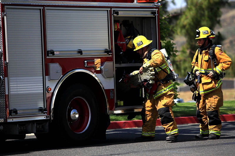 Firefighters at fire truck