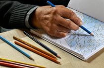 Person coloring in a coloring book