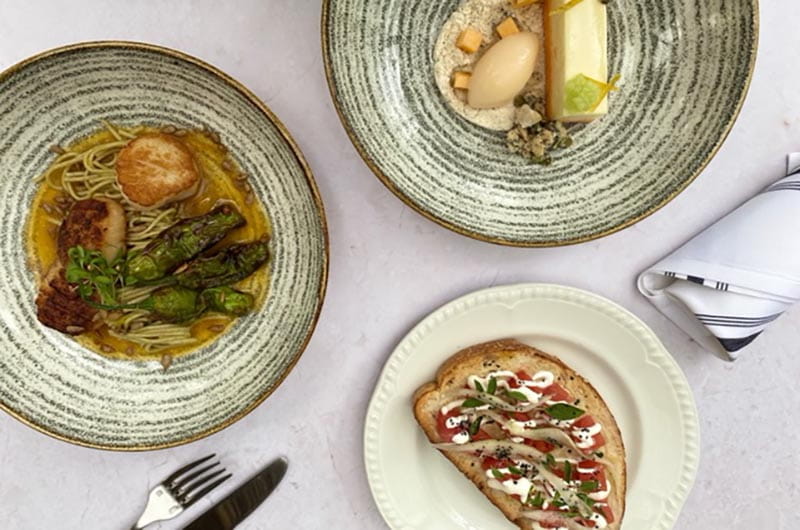 Three plates of food showing the three courses served during Terrain's special menu