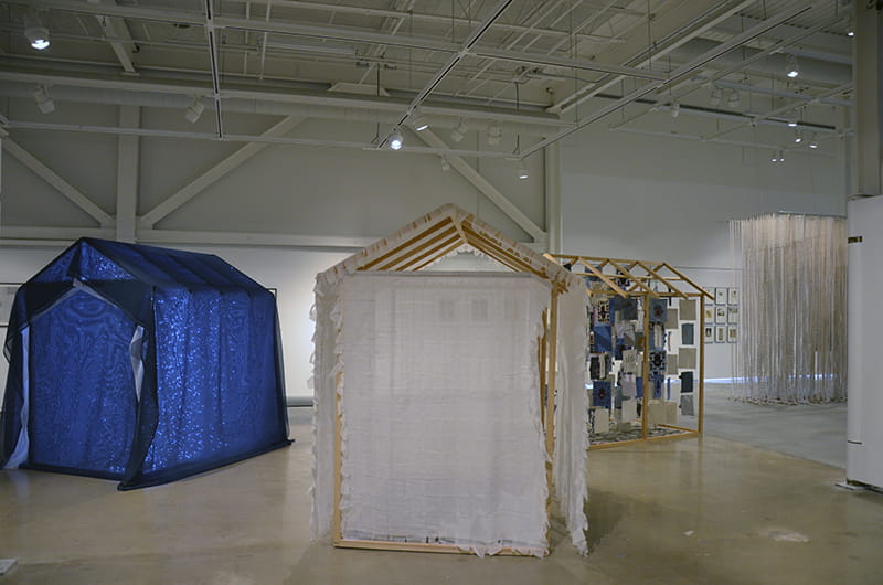 A view of the “Errors and Omissions” exhibition featuring art from Lisa Bond. 