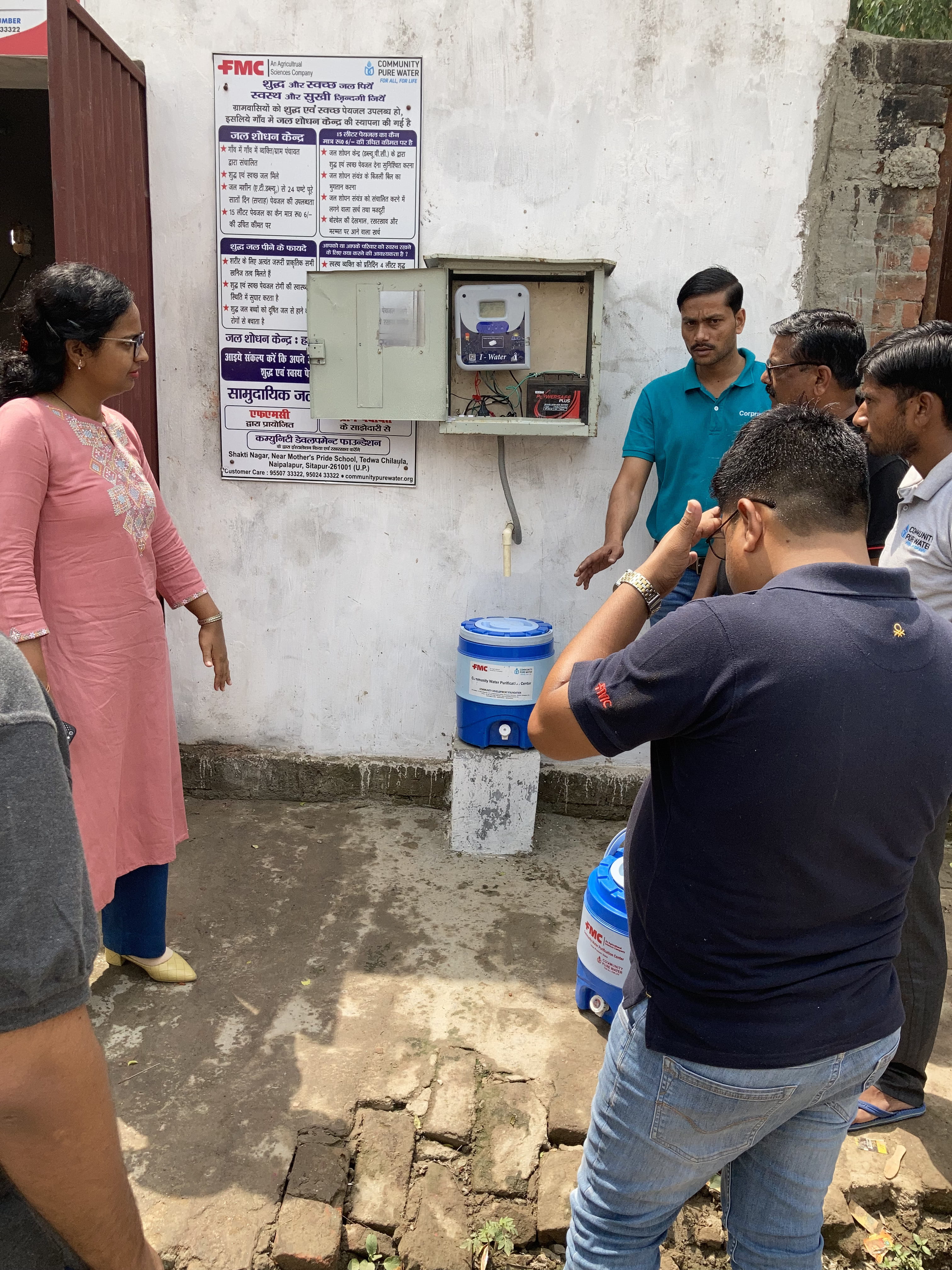 volunteers and villagers discuss