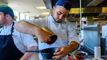 Student Zac Cohen works on a trial-run dish before the final presentation to Longwood Gardens. 