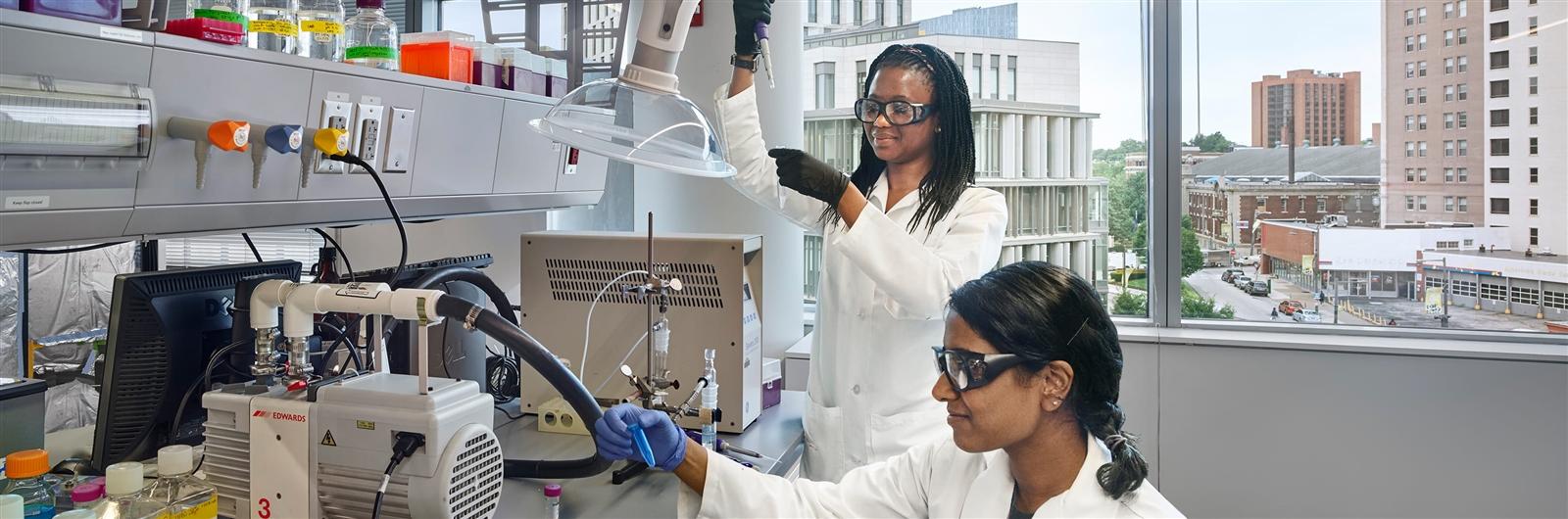 Two students working in lab