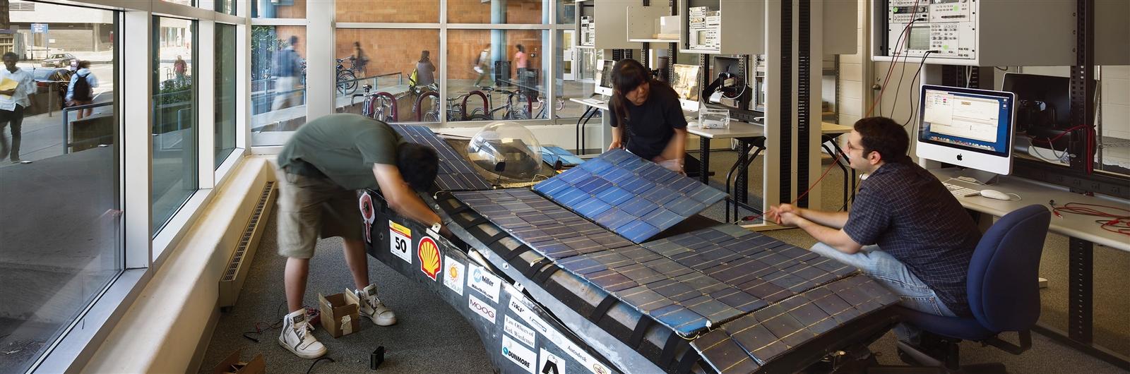 Students working with solar panels