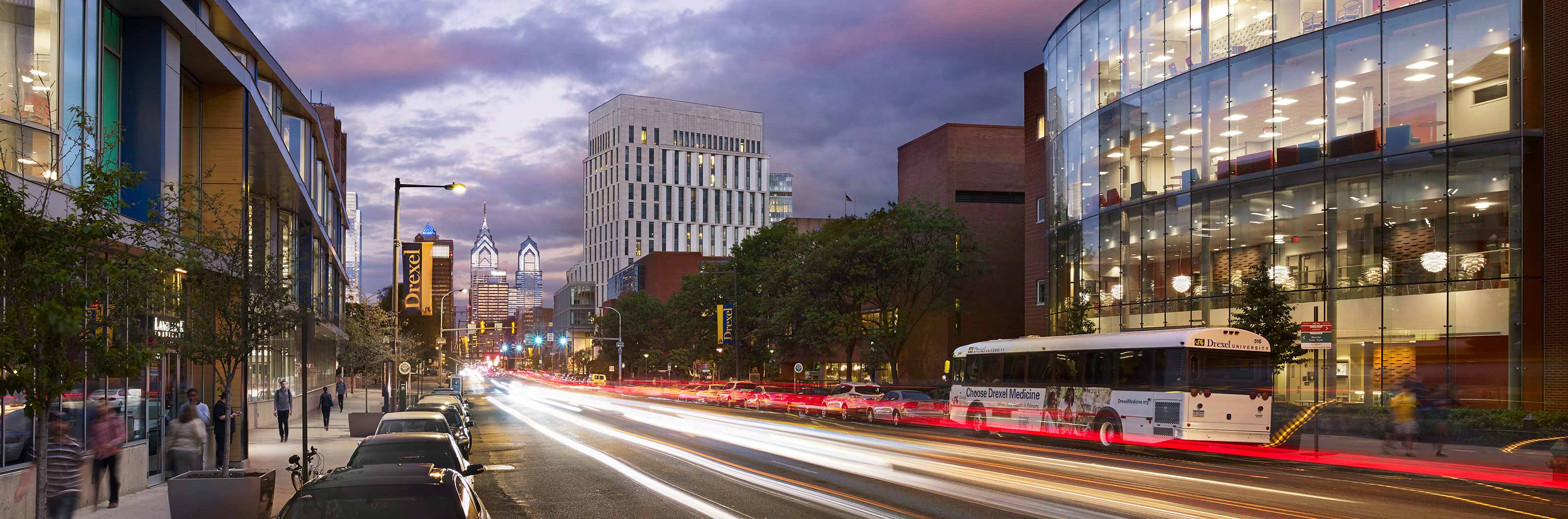 Nighttime view of Drexel's campus down Market Street