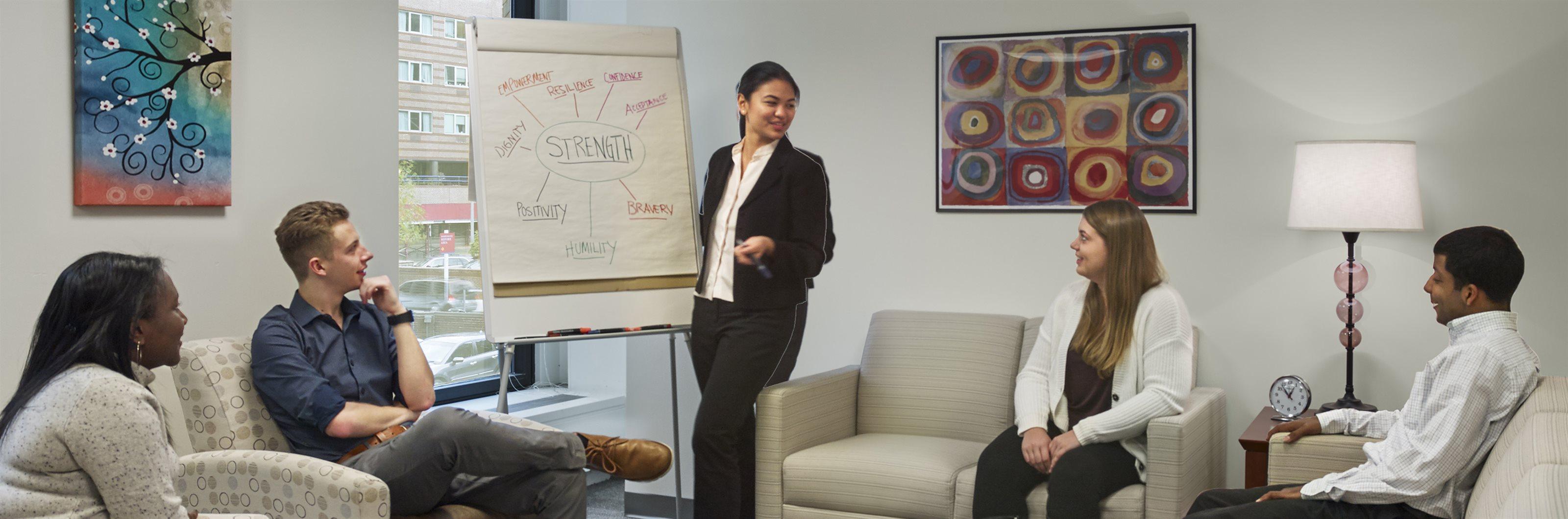 A nursing and health professional makes a presentation.