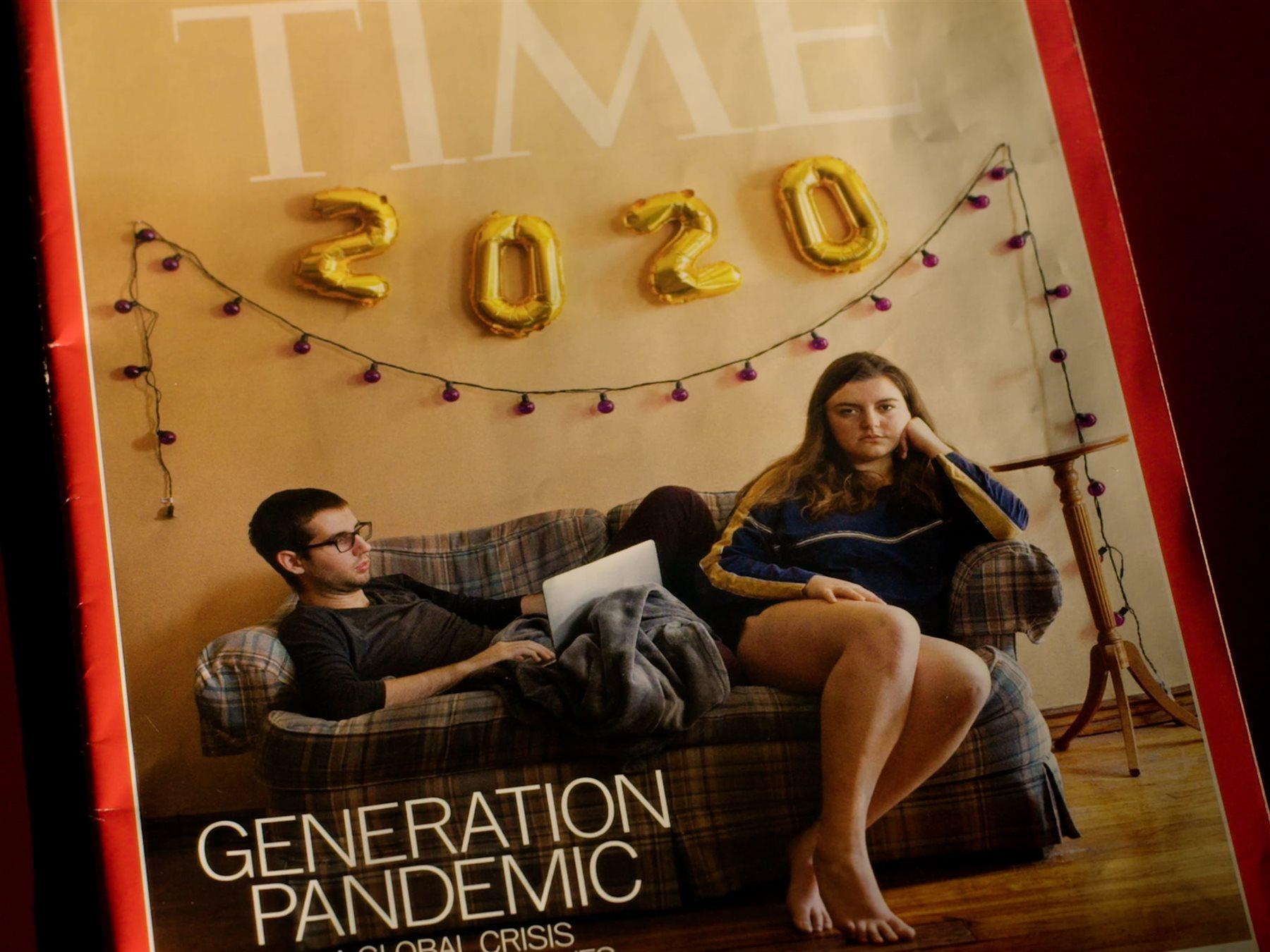 Two students sit on a couch under a 2020 banner on a "TIME" magazine cover