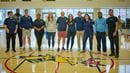 A row of Drexel employees lined up in the basketball court