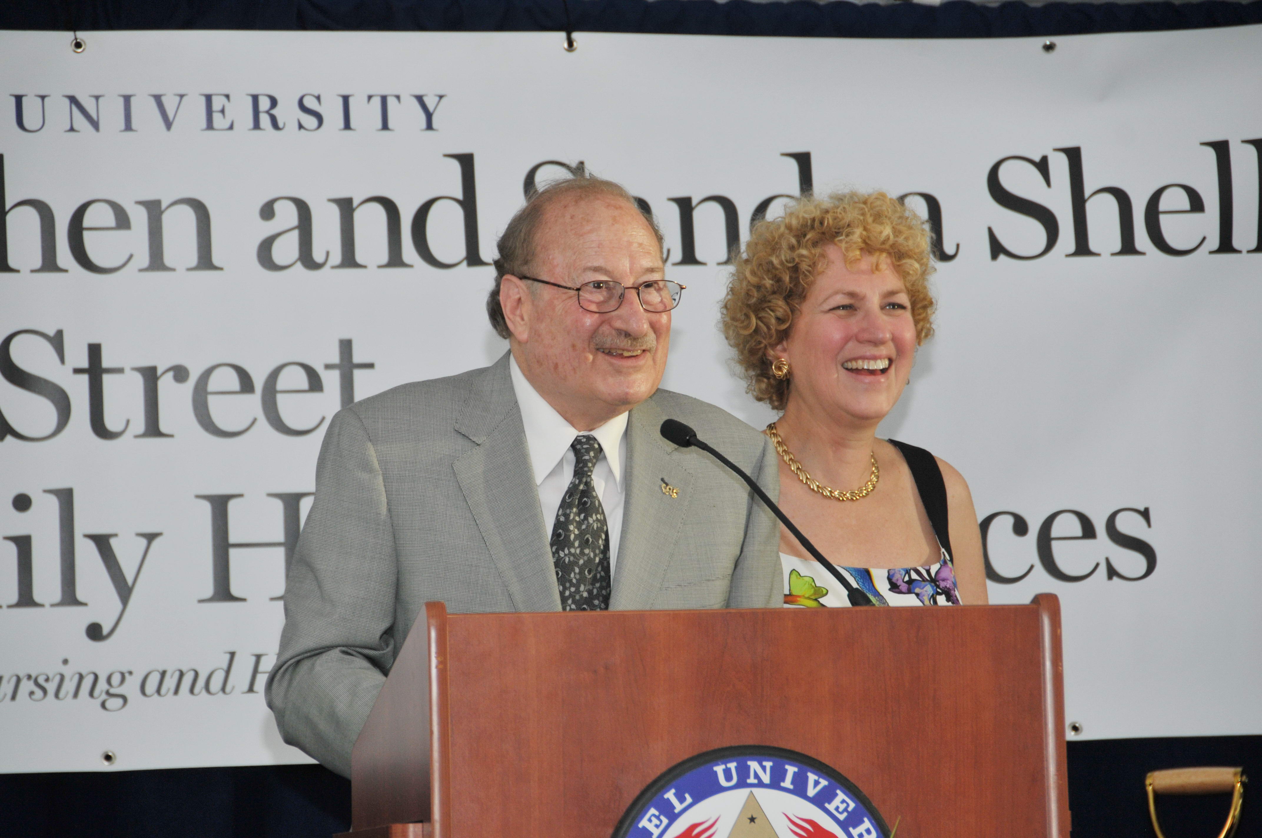 Stephen and Sandy Sheller at podium