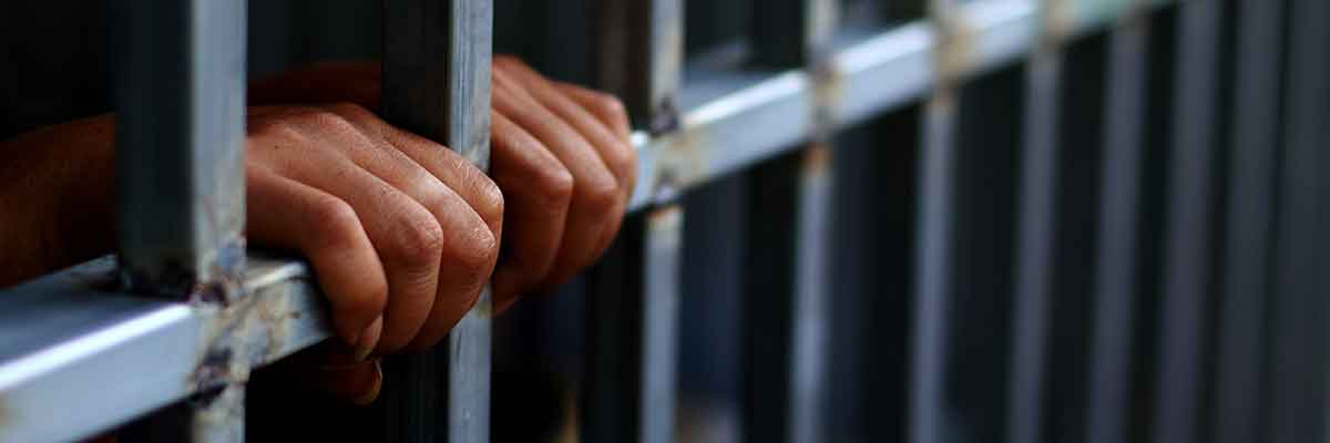 close-up photo of an incarcerated individual in prison