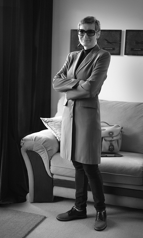 Black and white photo of Alina Palimaru standing