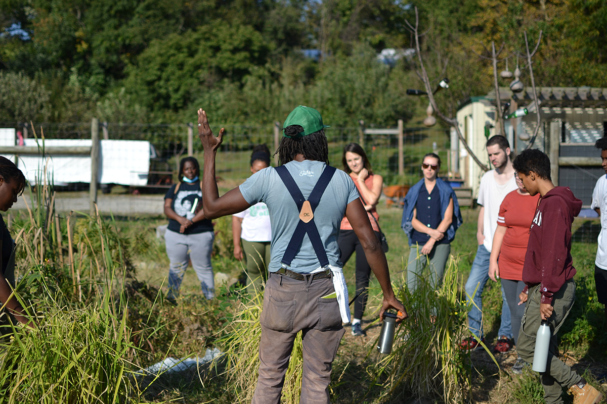 Chris Bolden-Newsome gives an interactive tour of Sankofa Farm