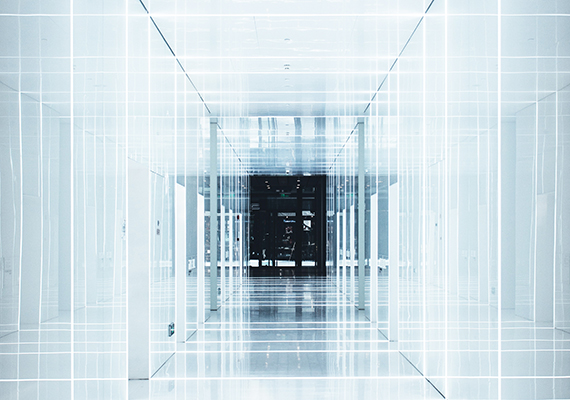 Image of a glass hallway with lights