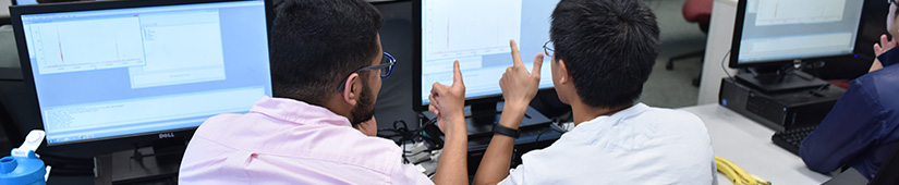 Students looking at computer screen