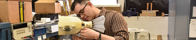 Student working on robot fish