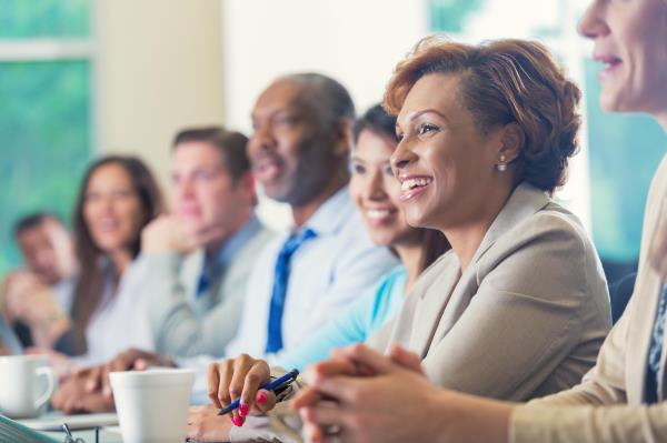 Group of adults smiling in a classroom
