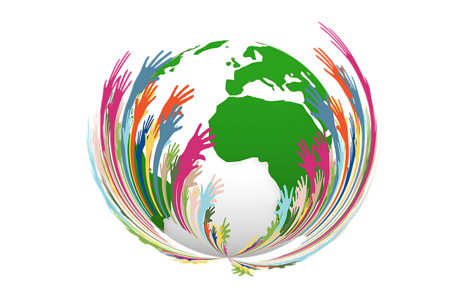 Image in vibrant colors of a globe with hands coming up and around it.