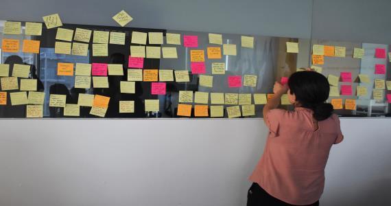 women with post-it board