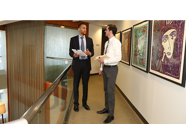 Student speaks with coop supervisor at Schnader Harrison.