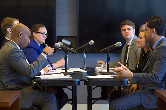 Kline students face off against Drinker Biddle associates in a transactional law exercise.