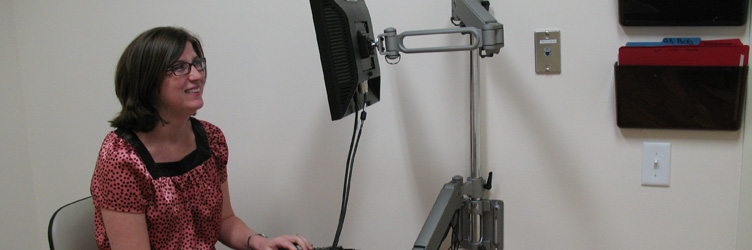 Drexel Department of Obstetrics and Gynecology faculty working in her clinical office.