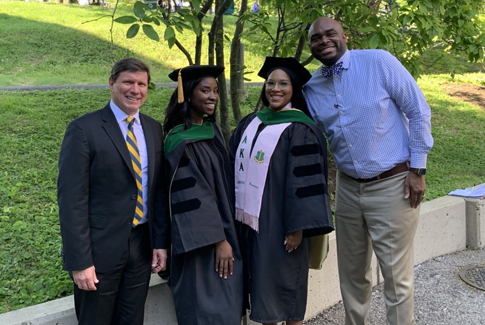 Dean Charles Cairns with Woman One Scholars Jacqueline Koomson and Dominique Jones, and Senior Associate Dean Leon McCrea