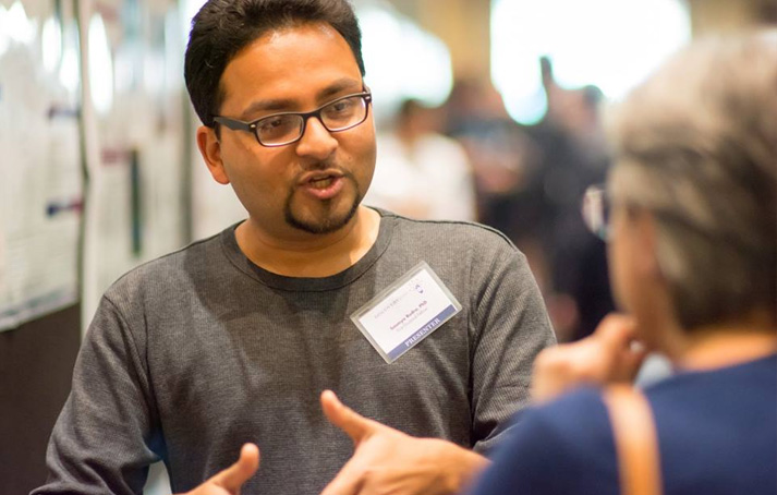 A presenter explaining his research at Discovery Day 2016