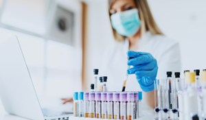 Close up of lab assistant in uniform.