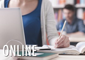 Female graduate student working in a library.