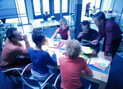 Graduate students studying around a table