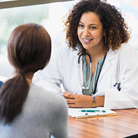 Doctor listens attentively to patient.
