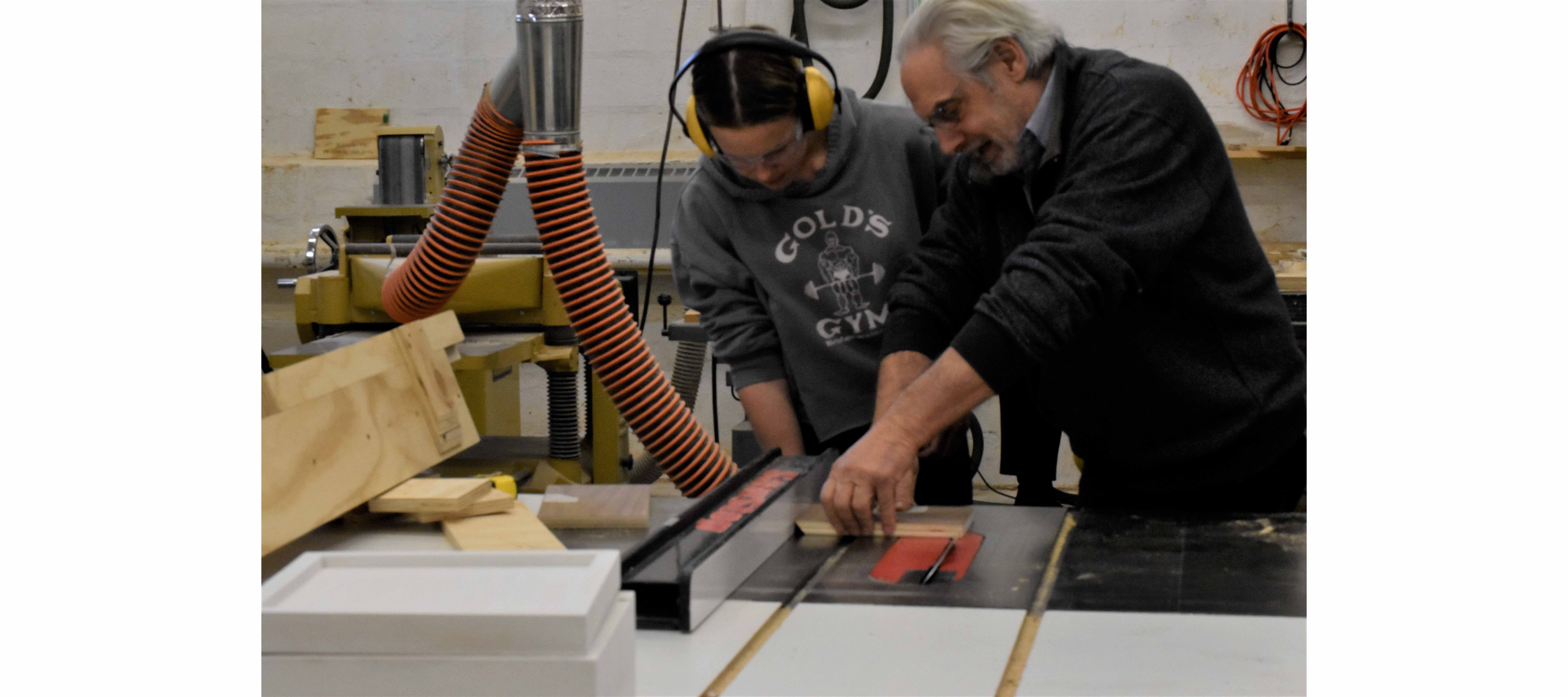 Professor Dino Pelliccia assisting a student in Multimedia: Materials course